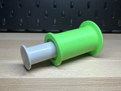The green sleeve pushed over the white original tube — the way it sits later