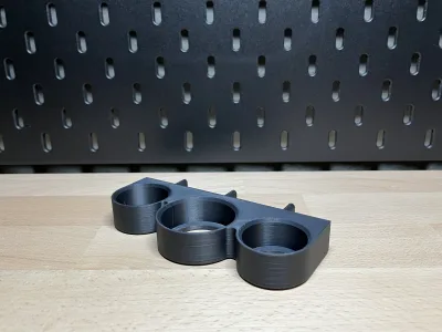 The same variant photographed flatter in front of the black pegboard
