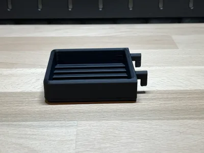 The holder from the side, the two hooks standing out at the back
