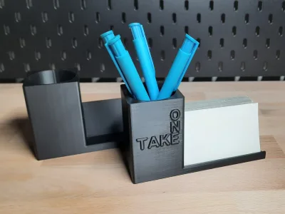 Both variants side by side: on the left the plain cup, on the right the one with the embossed TAKE ONE and cards in the tray